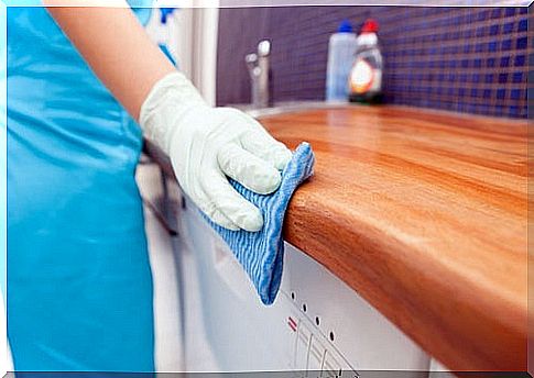 Woman cleaning allowance with apple cider vinegar.