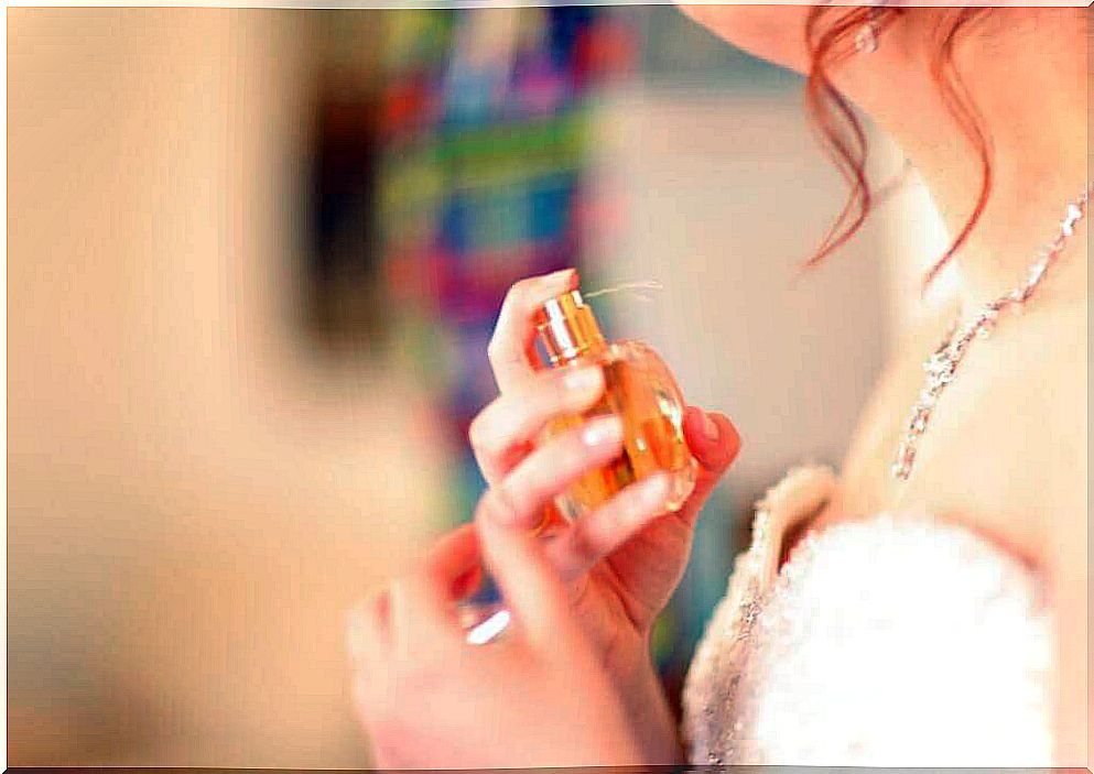 woman applying perfume