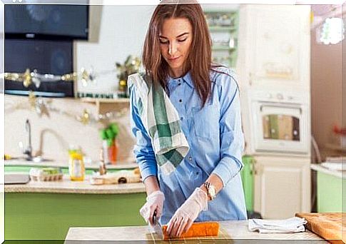 Woman cooking at home to have healthy food.