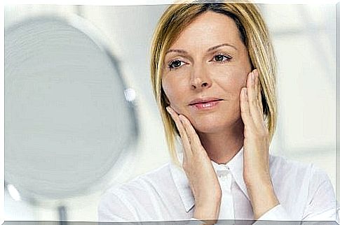 Woman using chamomile and cucumber tonic to firm her skin