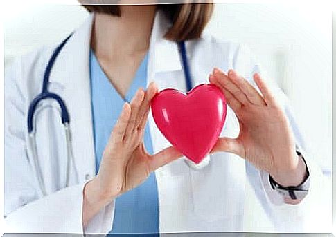 Doctor with a heart in his hands.