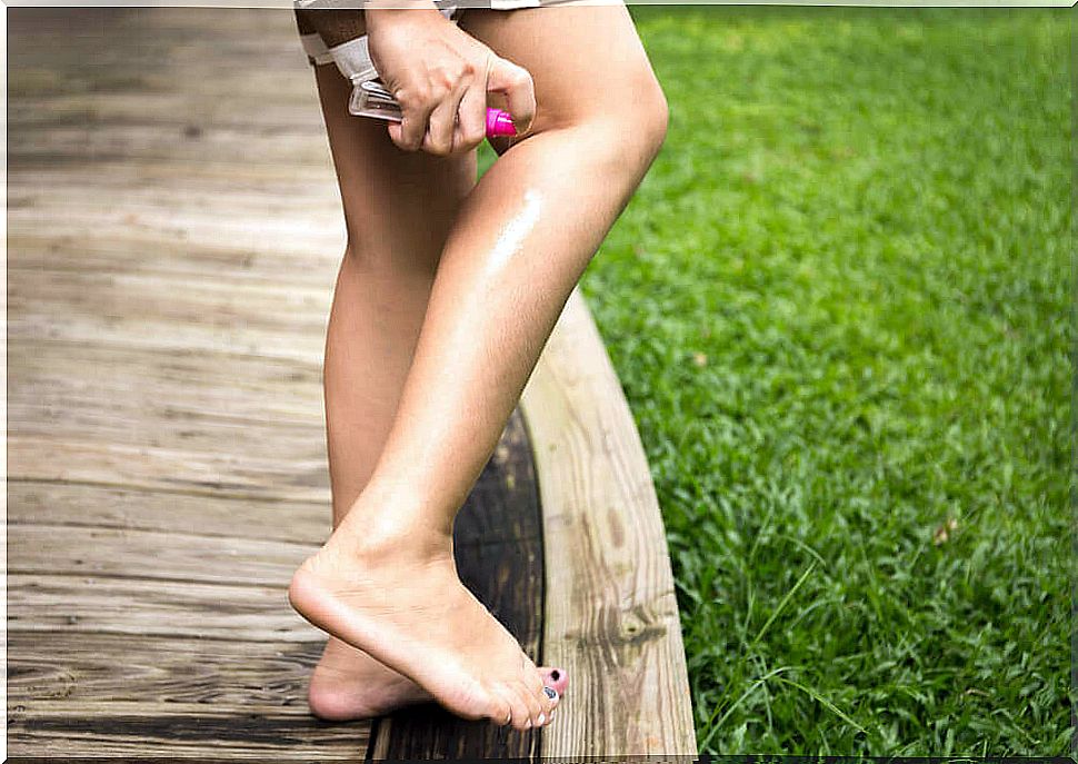 Woman applying homemade anti-mosquito lotion