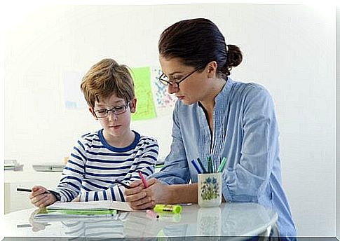 Mother teaching child with learning problems